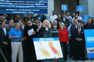 Assembly Minority Leader Connie Conway (R-Tulare) addresses the rally as Assembly Member Henry T. Perea looks on.