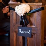 White floral décor with black satin ribbon at Toronto Wedding ceremony