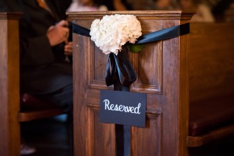 White floral décor with black satin ribbon at Toronto Wedding ceremony