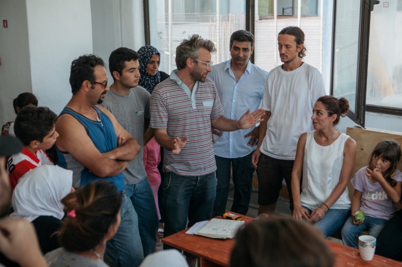 Mike Zuckerman (striped shirt) with Elpida residents.