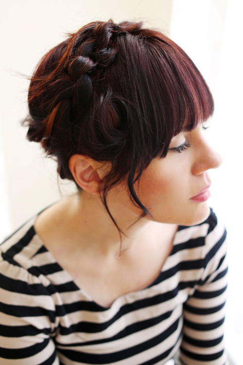 casual updo with knotted braid and bangs