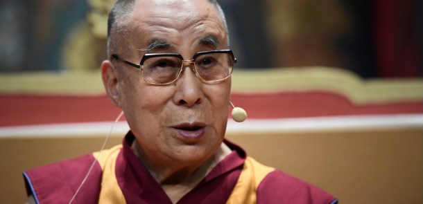 The Dalai Lama delivers a speech during a group hearing at the Palais des Congres, on September 13, 2016 in Paris, during his first visit to France in five years. / AFP PHOTO / Eric FEFERBERG