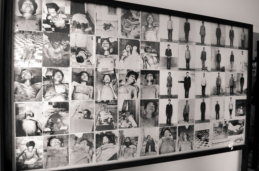 A board of photos on display at Tuol Sleng Prison in Phnom Penh depicting victims of the Khmer Rouge