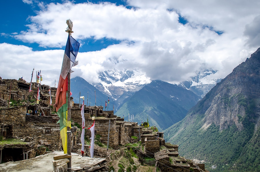 Prayer flags flying over the cobblestone village of Ghyaru, Nepal.