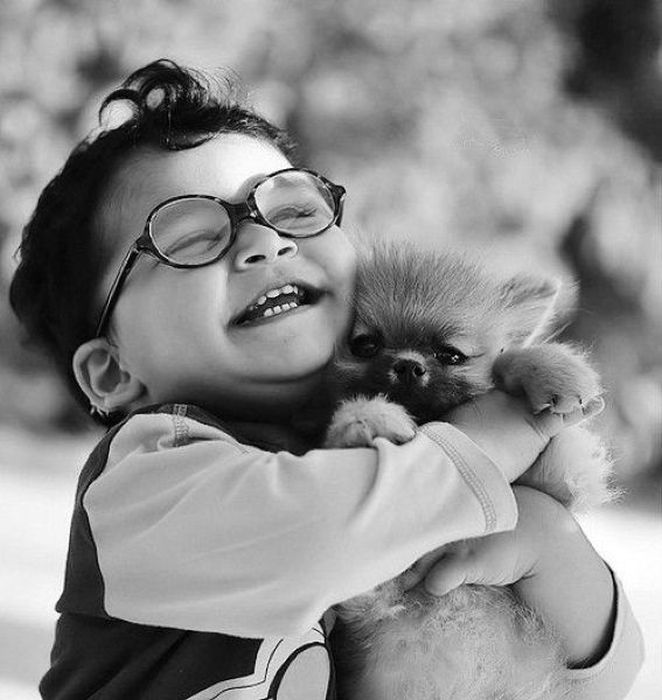 Kid Hugs Puppy