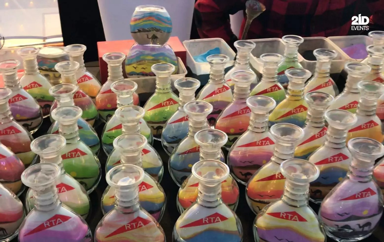 SAND BOTTLE ARTIST FOR CORPORATE EVENT — 2ID EVENTS
