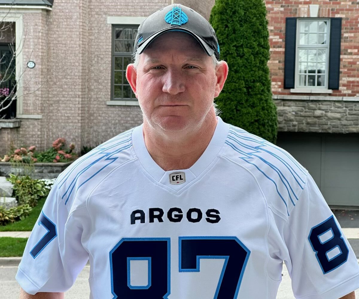 Ticats CEO Scott Mitchell loses bet, sports Argos jersey for franchise