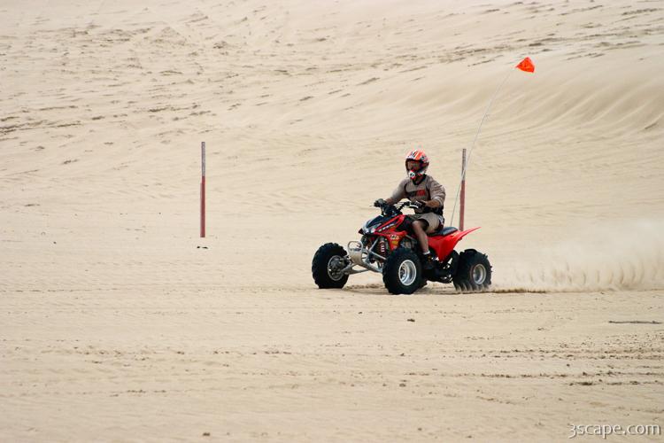 Quad ATV riding in dunes Photograph by Adam Romanowicz