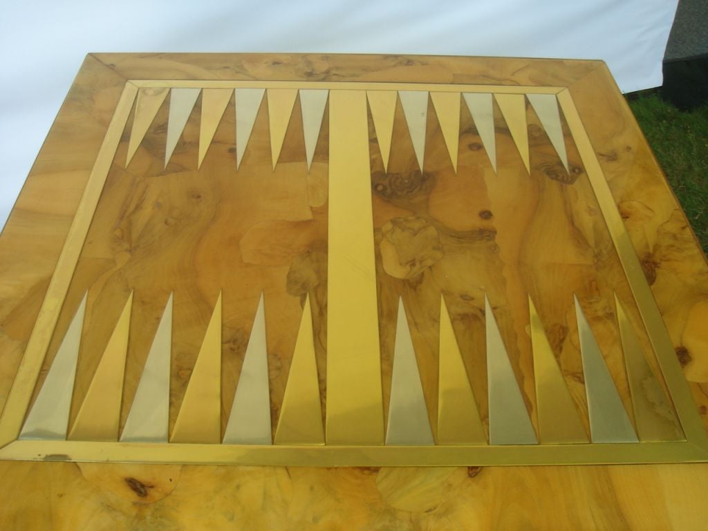 An Olivewood Burl Games Table with inset Metal Backgammon Board at