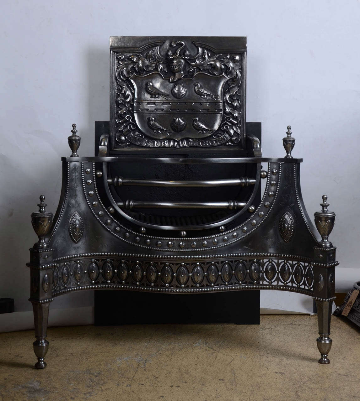 Pair of Antique Polished Cast Iron Fire Baskets with Coat of Arms For