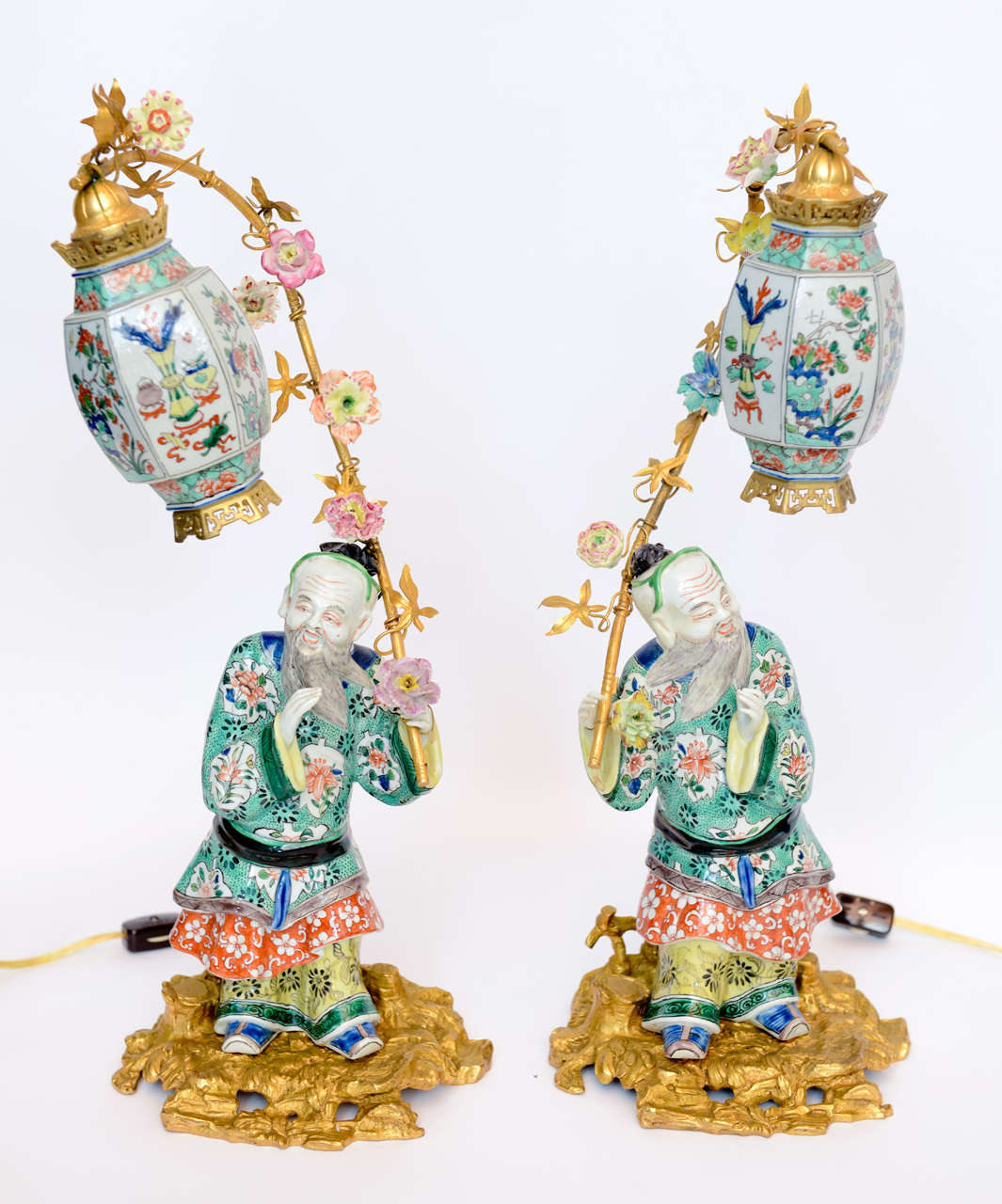 Pair Of Chinese Porcelain Figurines Holding Up Lanterns at 1stDibs