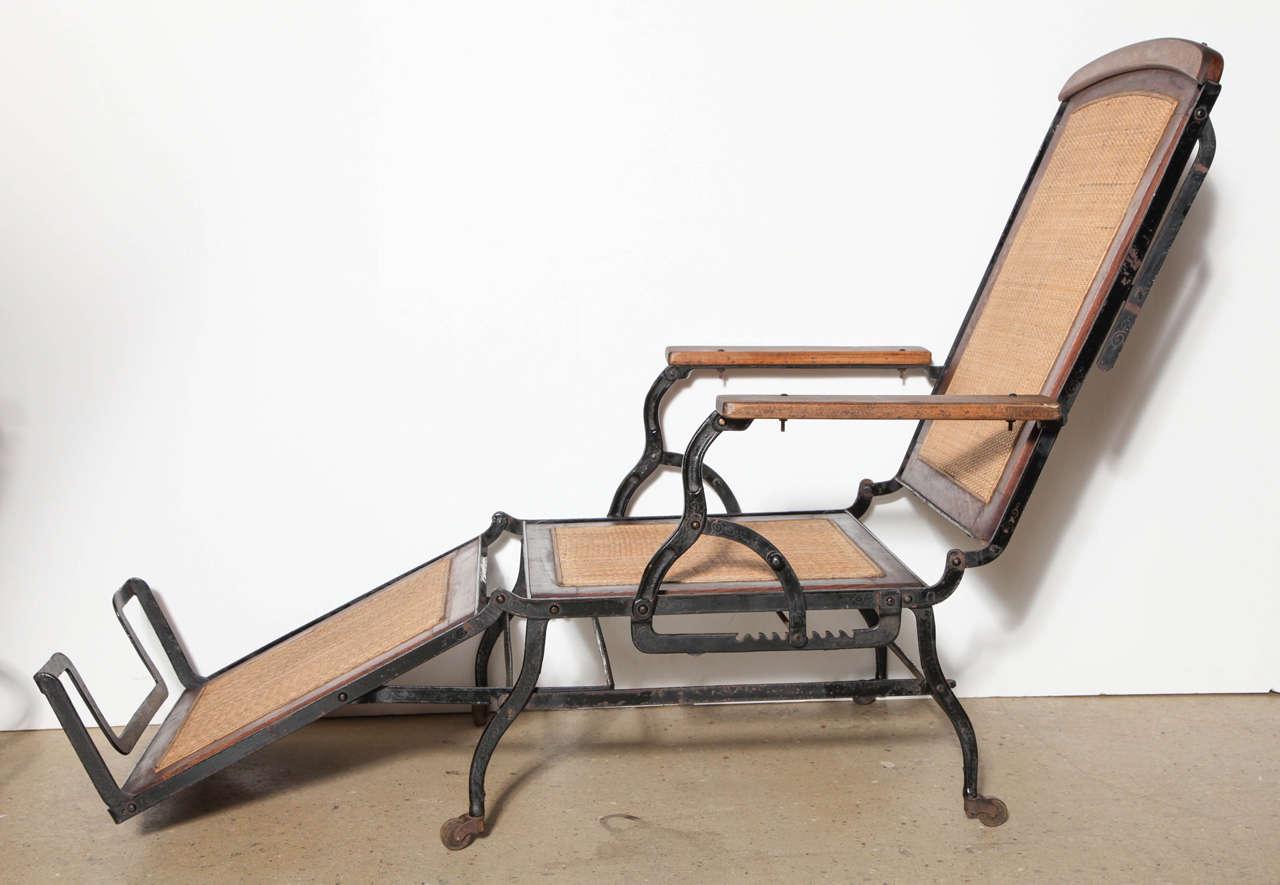 Cevedra Sheldon Walnut, Cane and Cast Iron Rolling Chaise Lounge Chair