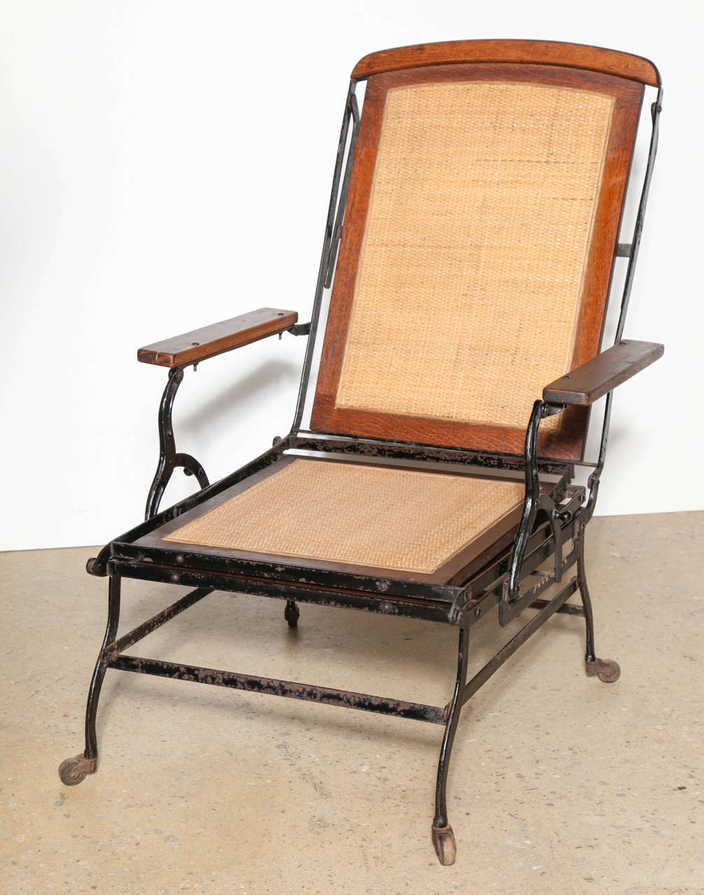 Cevedra Sheldon Walnut, Cane and Cast Iron Rolling Chaise Lounge Chair