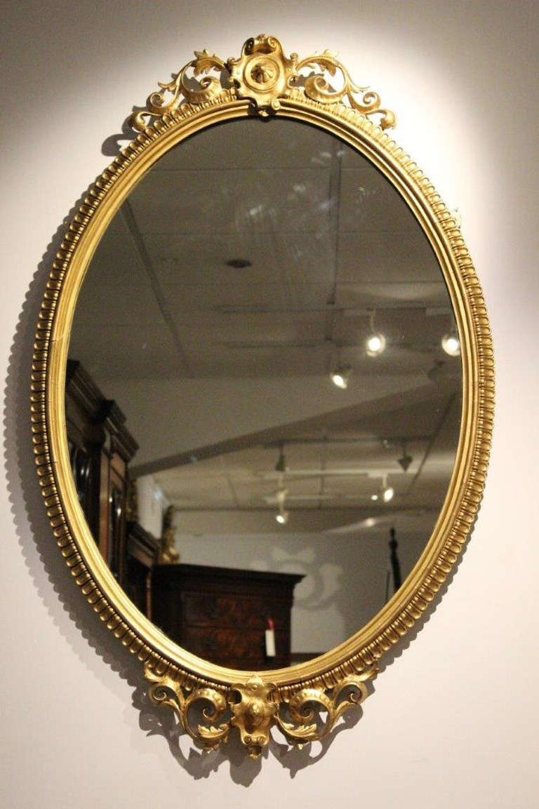 Fine Pair of Giltwood and Gesso Victorian Period Antique Oval Mirrors