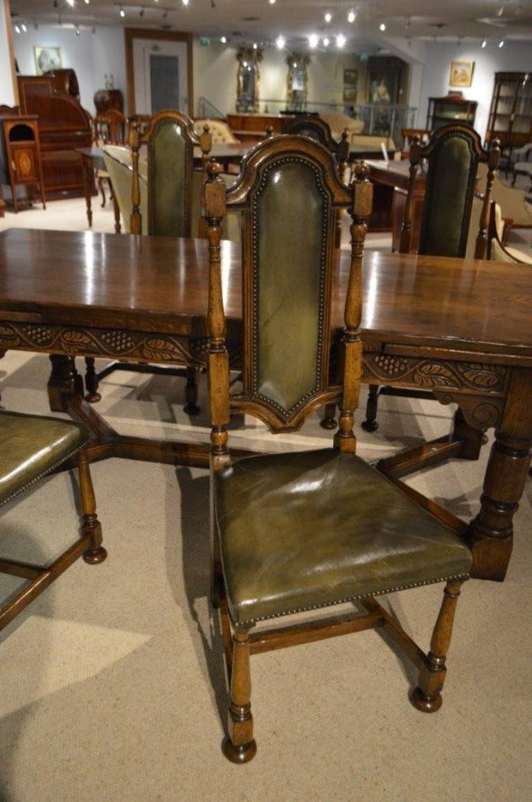 An Oak Jacobean Style Refectory Table And Set Of 12 Oak Dining Chairs