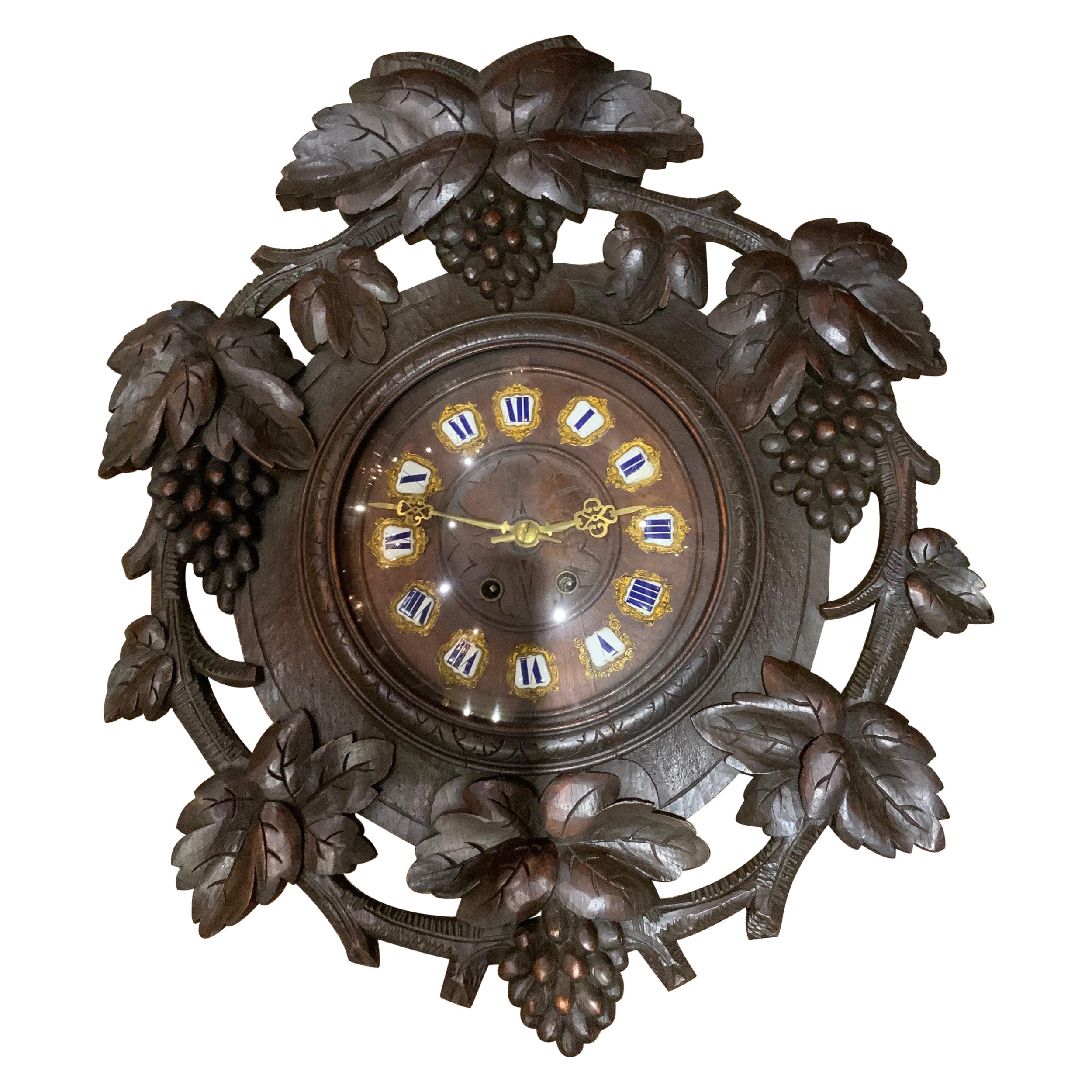 Sizable Antique and HandCarved Black Forest Wooden Wall Clock w. Brass