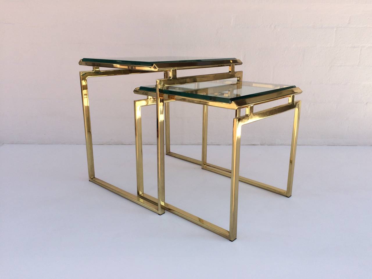 Polished Brass and Beveled Glass Nesting Tables Designed by Milo