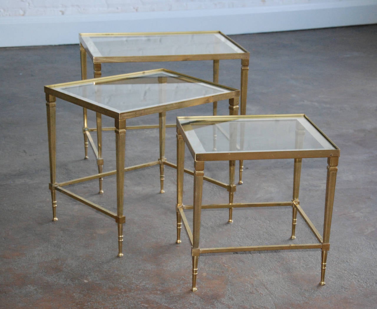 Italian Brass and Mirrored Glass Trio of Nesting Tables, circa 1950