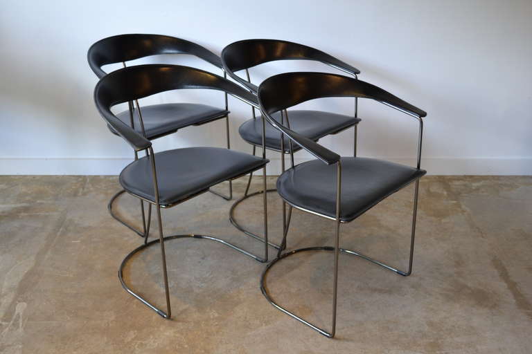 four black leather and gun metal chrome dining chairs by aarben, italy