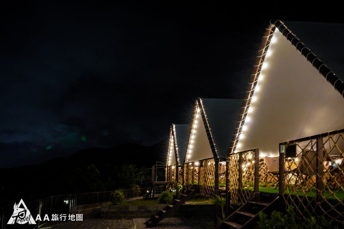 First row of tents at night