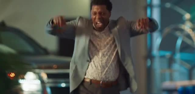 man dancing in a gray suit Ad Commercial on TV