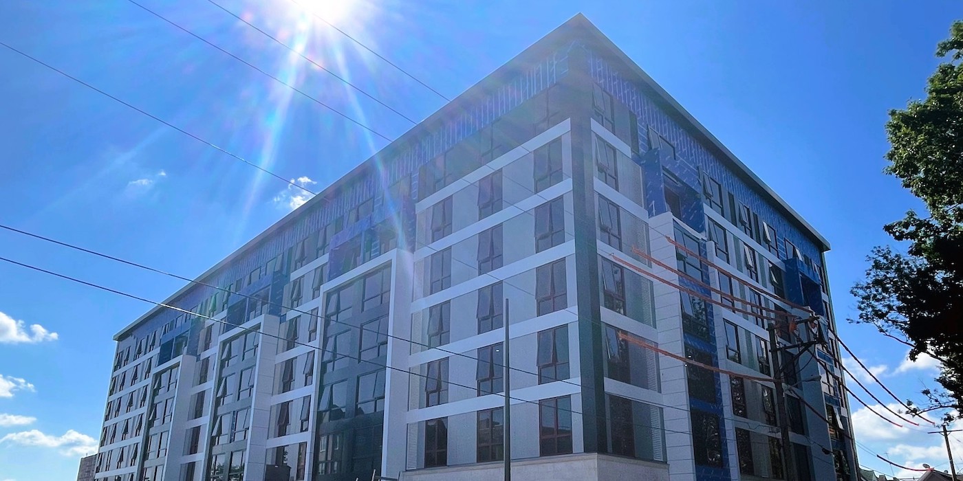 Olympic Tower Apartments Above Green