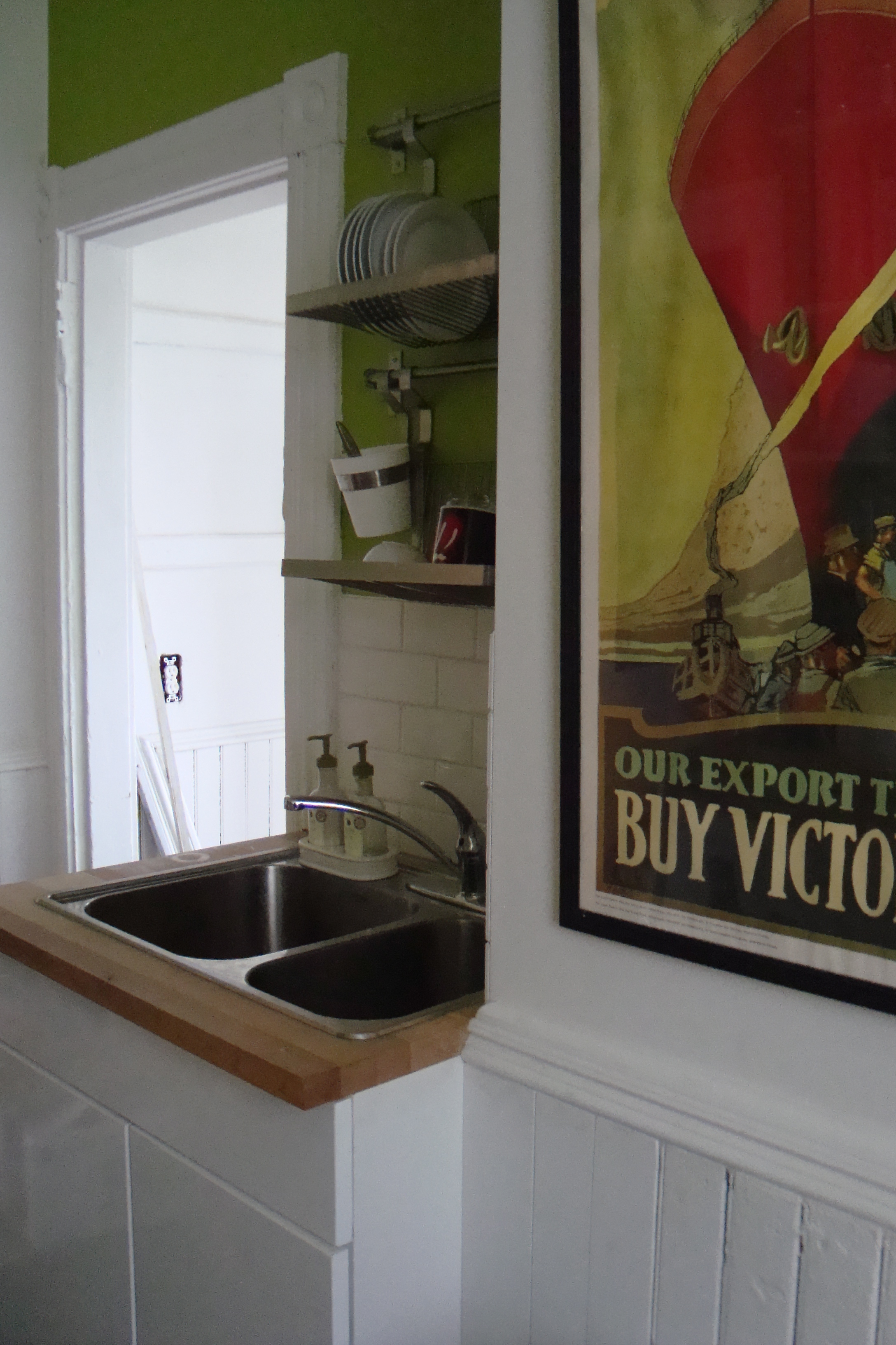 the kitchen before and after a cat peed on my drywall