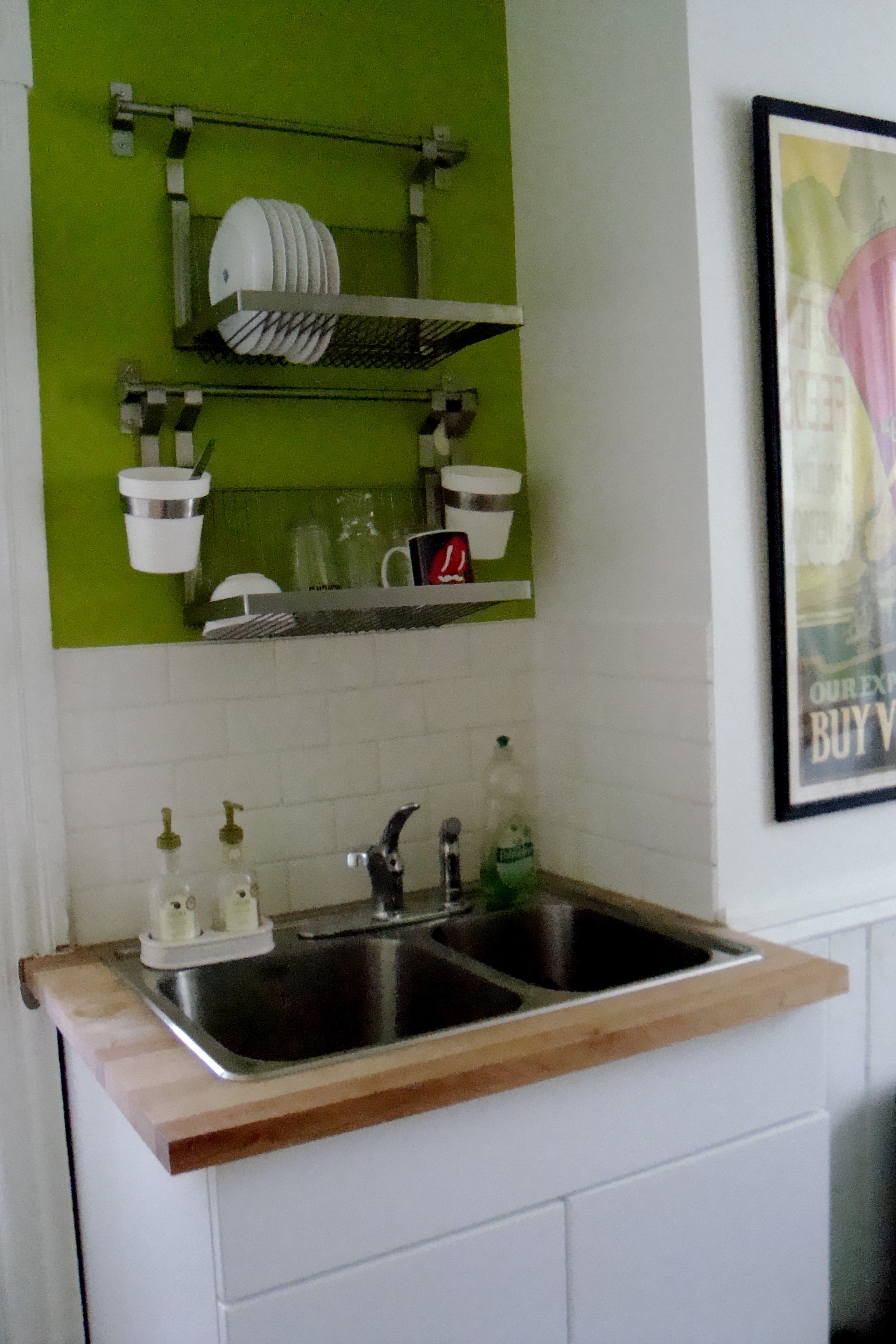 the kitchen before and after a cat peed on my drywall