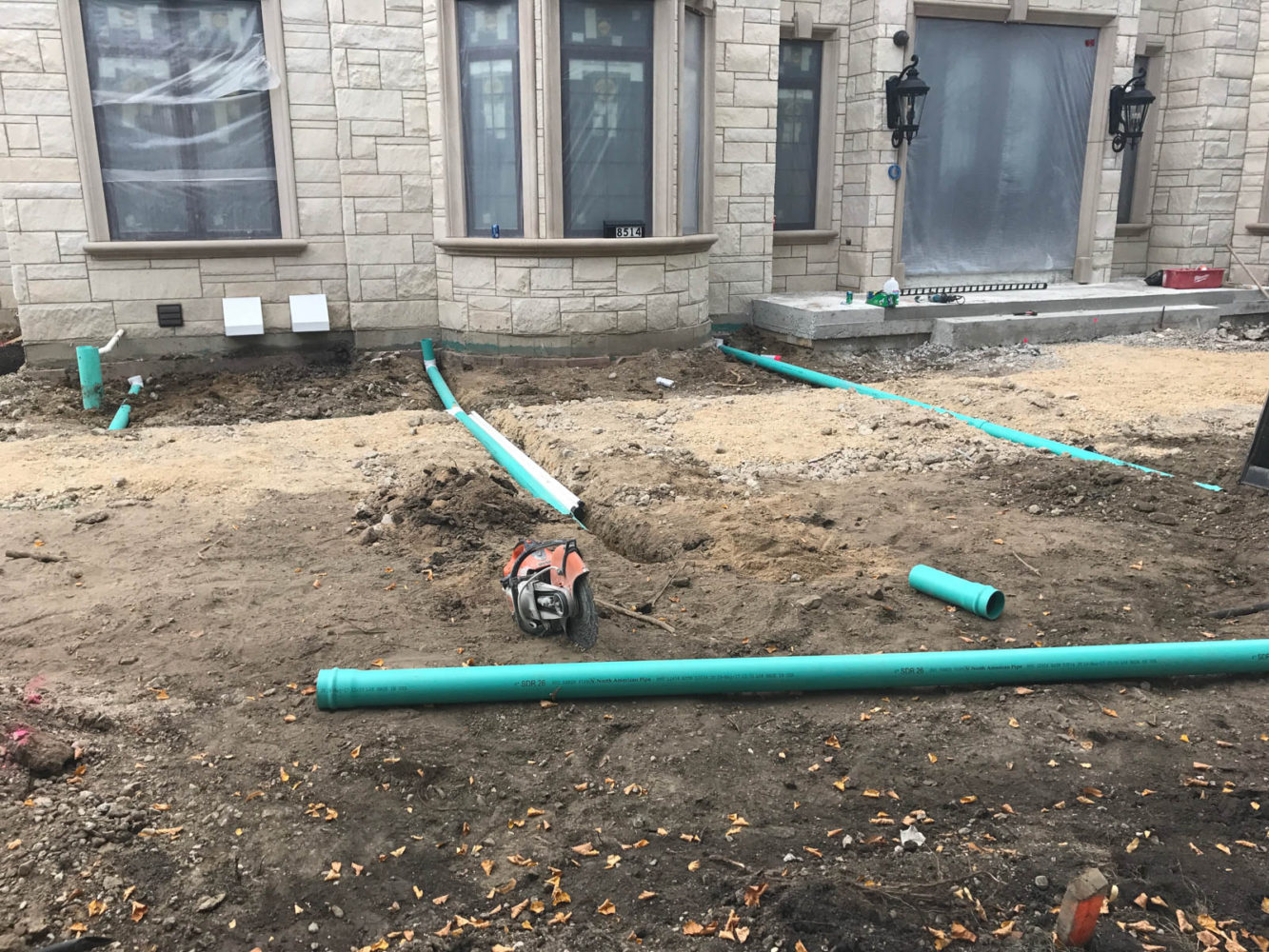Redirecting the downspouts at the new construction in Morton Grove