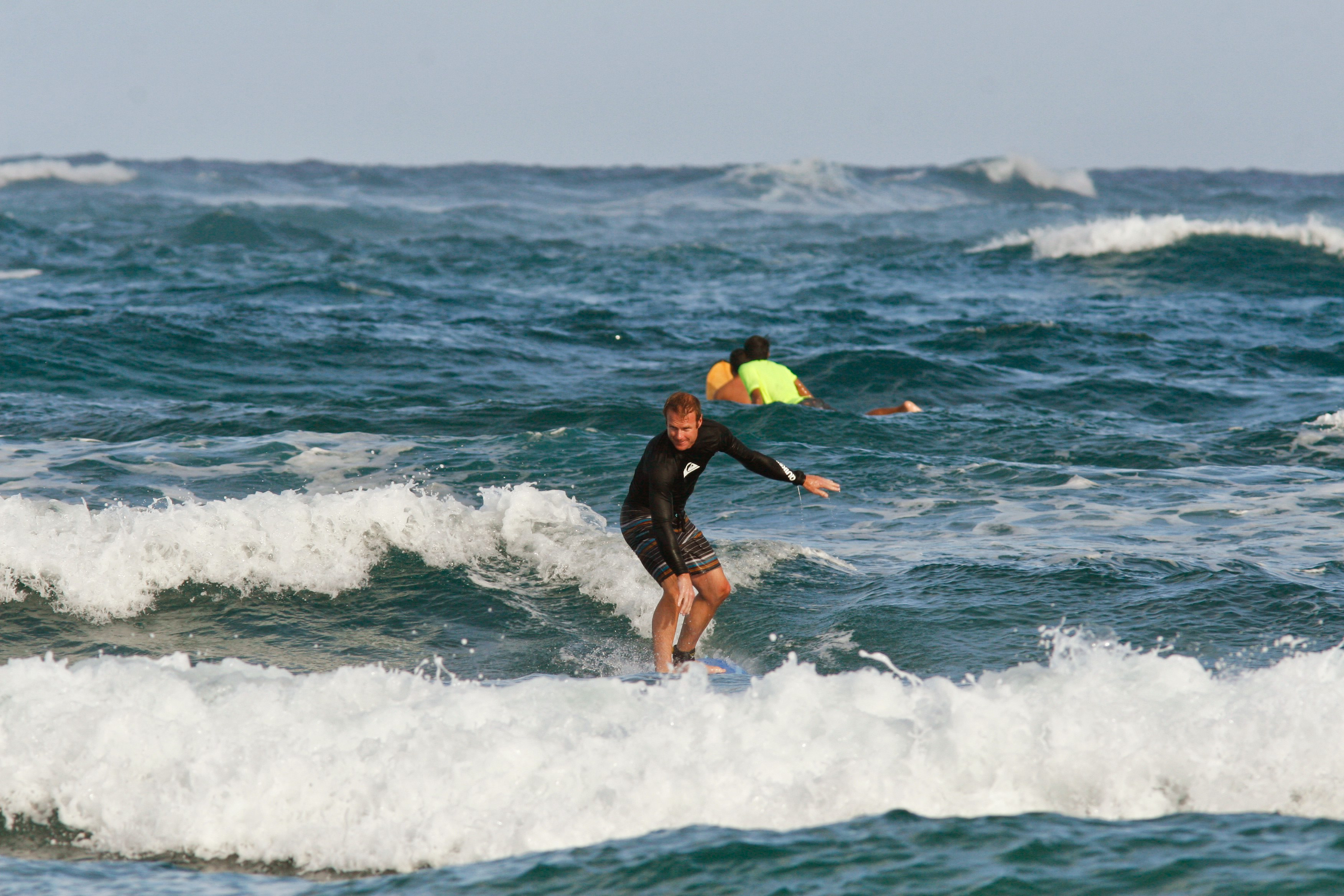 Longboard surfing at Kahana Bay Active Oahu