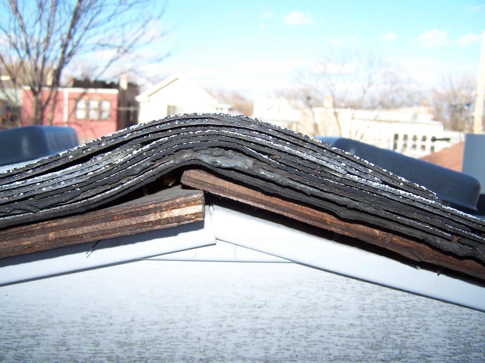 Why Tear Off the Old Shingles?