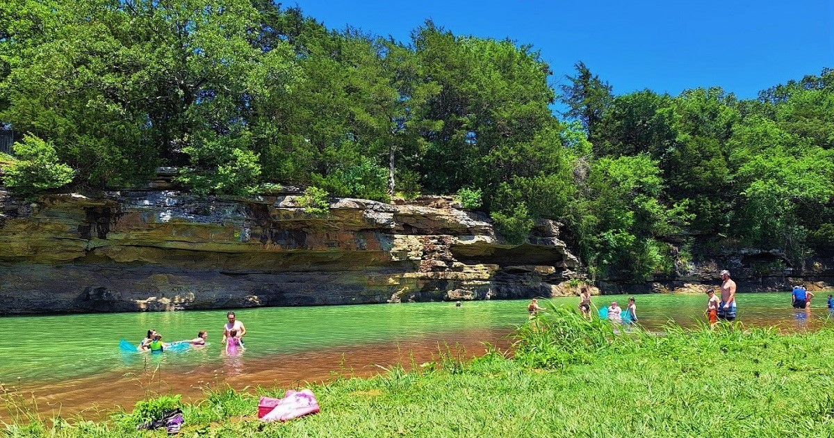 This Emerald Swimming Hole With A Rope Swing And Diving Cliffs In