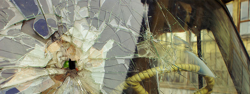 Who Is Responsible for Cracked Windshield if Dump Truck Loses Debris On