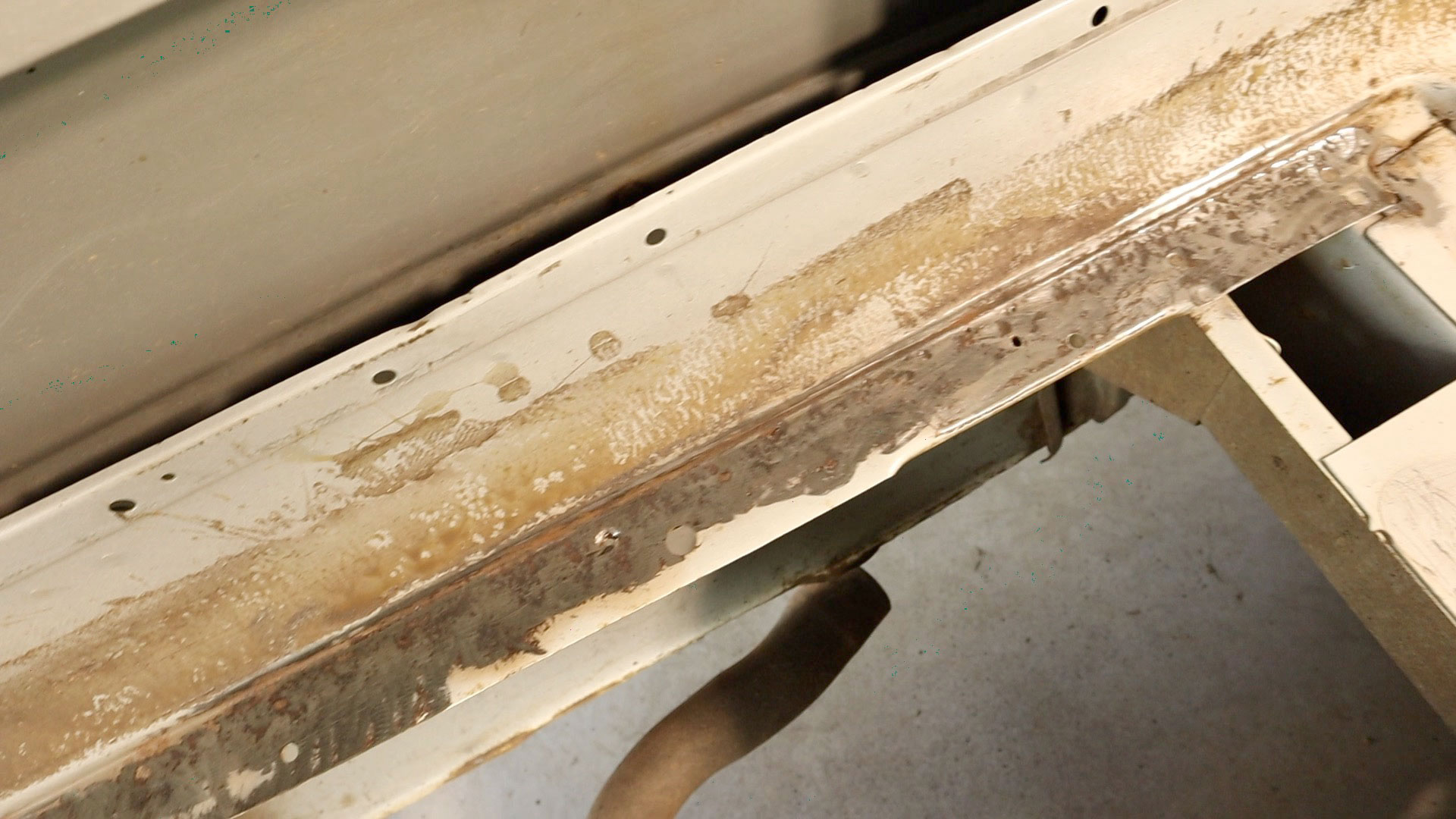 Treating rust and painting the subfloor frame A Girl A Dog and A Bus