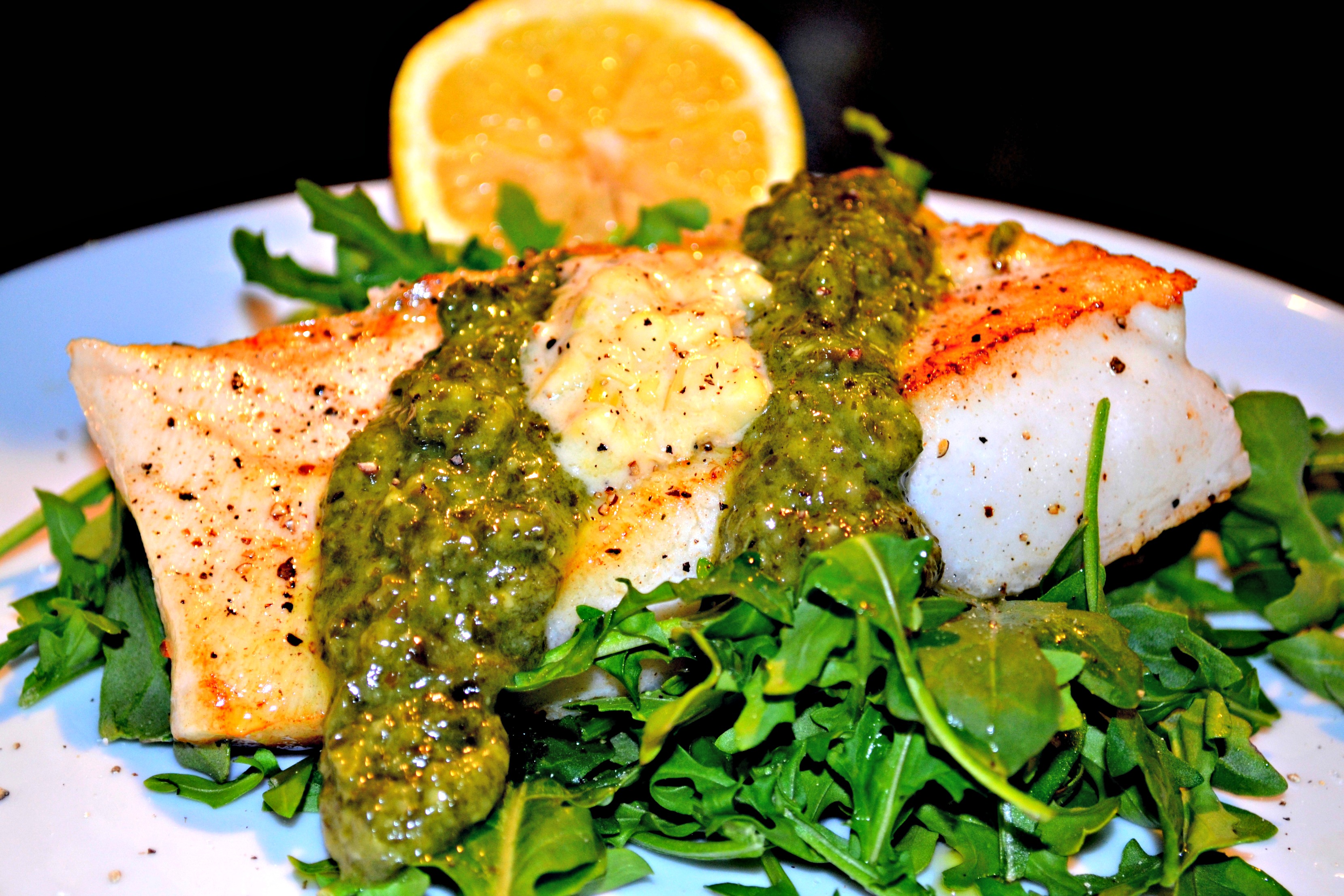 Chilean Sea Bass with Basil Pesto, Creamed Corn and Arugula A Hint of