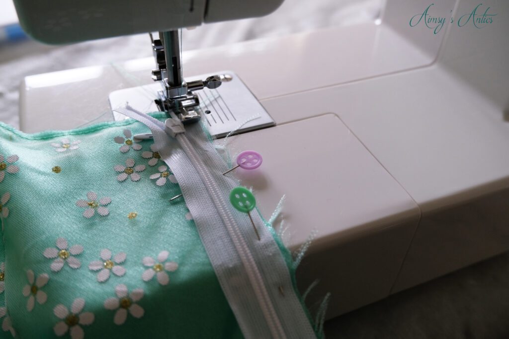 Zip pinned and being sewn to DIY bustier dress