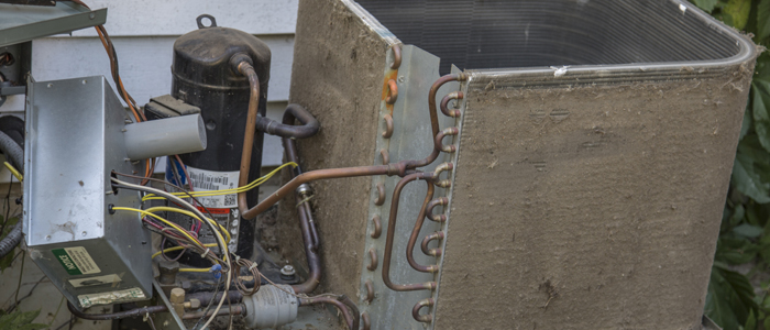 Dirty and clogged air conditioner condenser cooling fins - All Day Air
