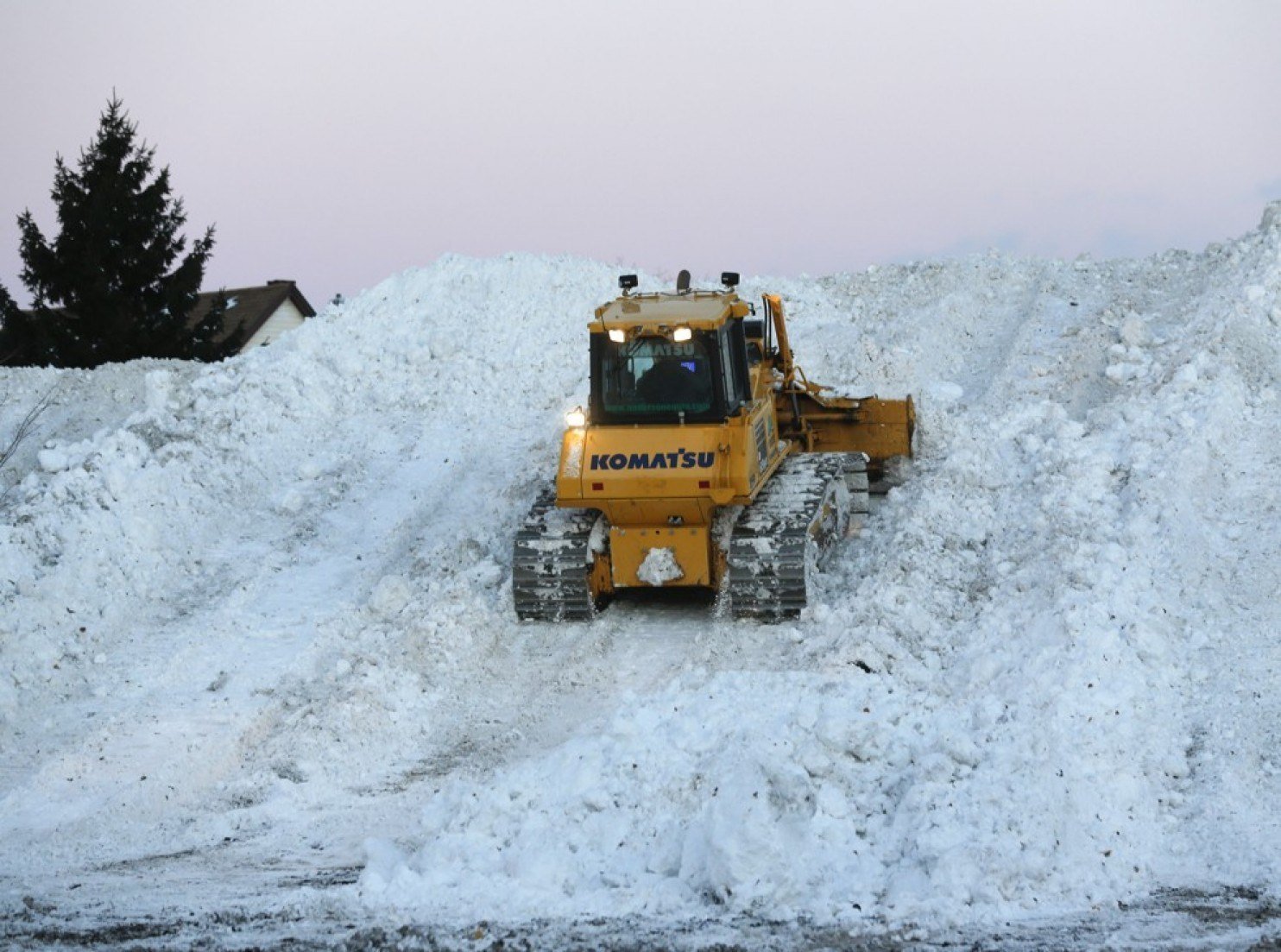 Bulldozer attempts to clear snow in Buffalo, NY.