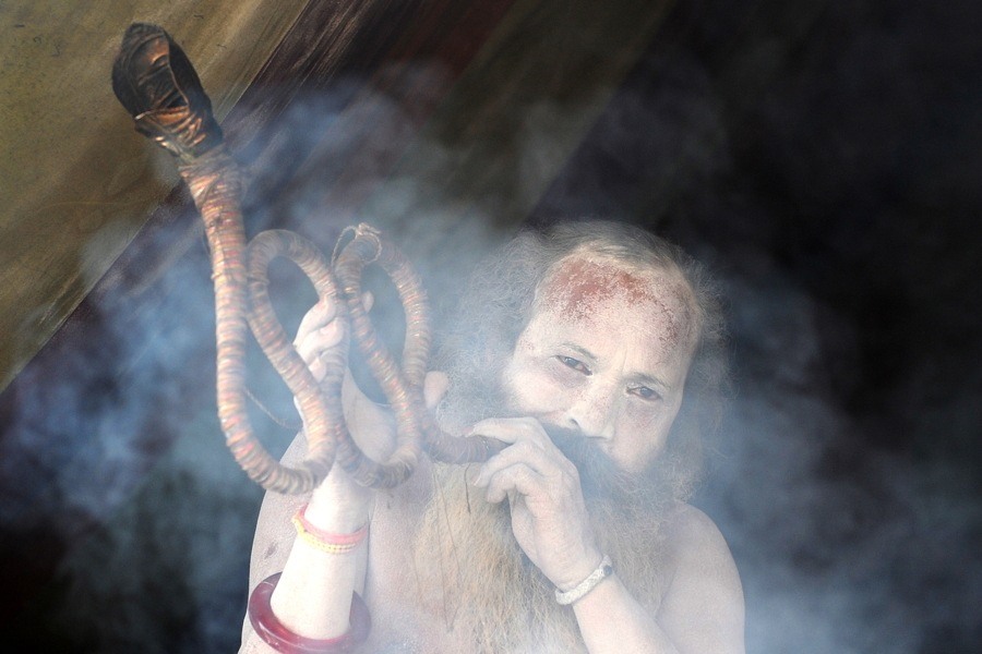 Man Smoking Long Pipe