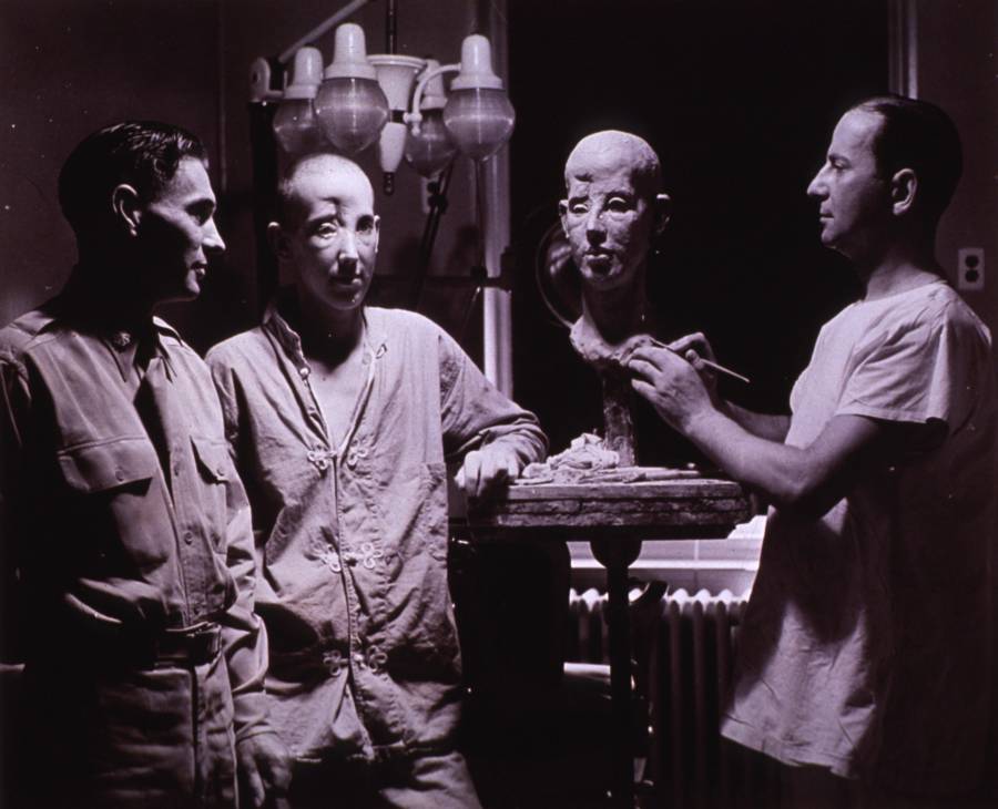 Posing With Plaster Mask