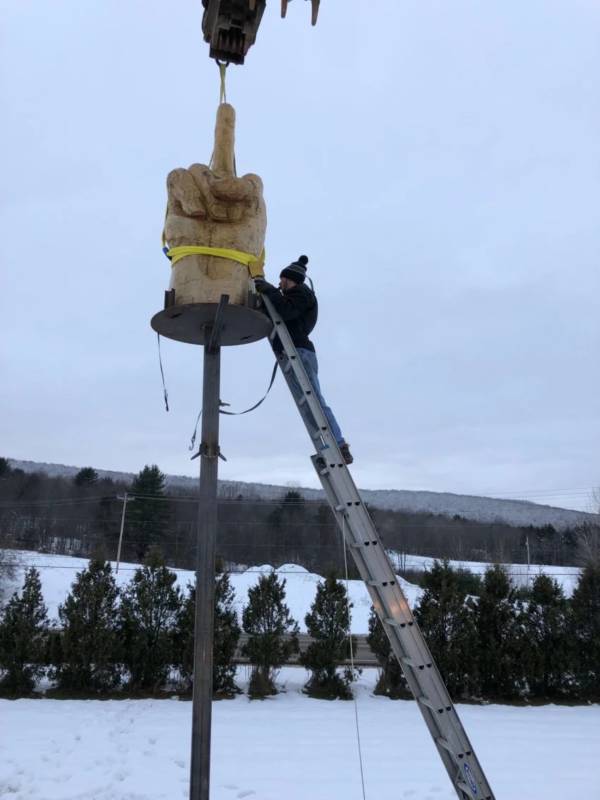 Man Working On Statue