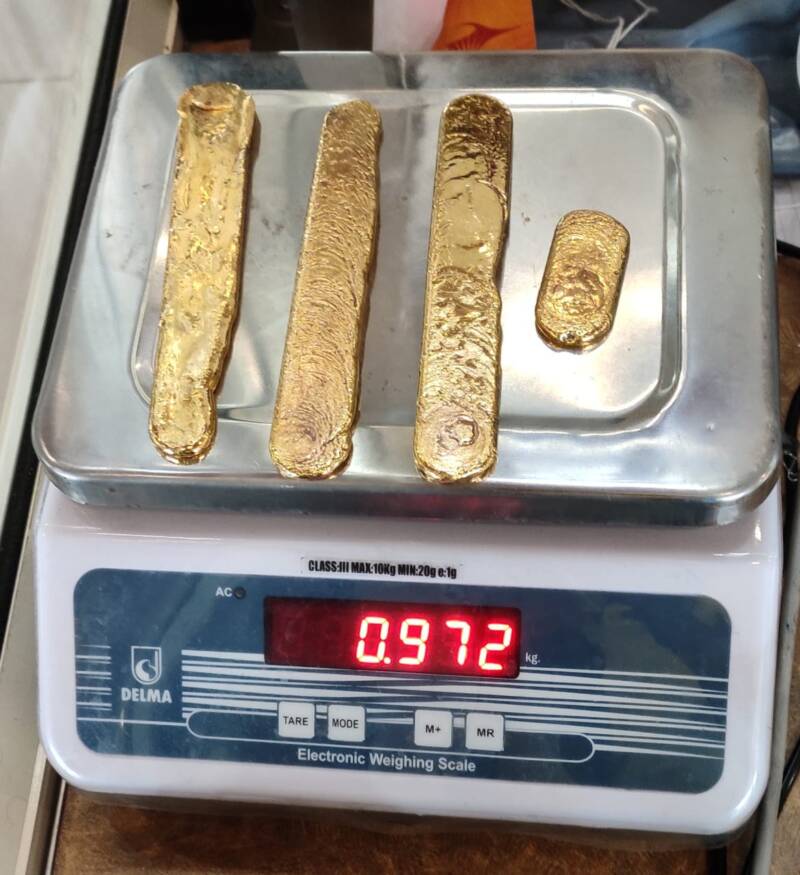 Gold Being Weighed