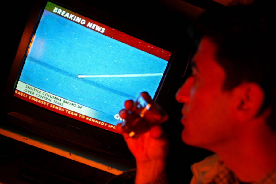 Man Watching Columbia Crash News