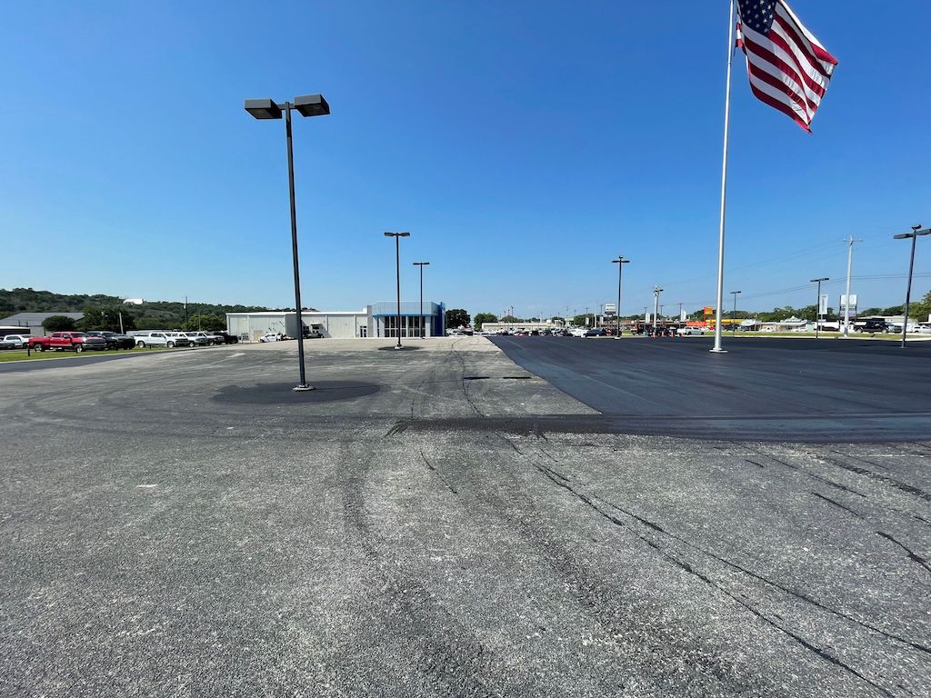 Asphalt Sealcoating & Striping Chevrolet Dealership in Marble Falls, TX