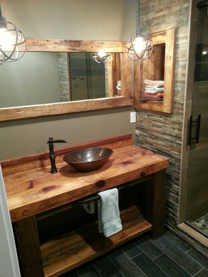 A repurposed vintage console table works well as a vanity. reclaimed barn wood vanity with vessel