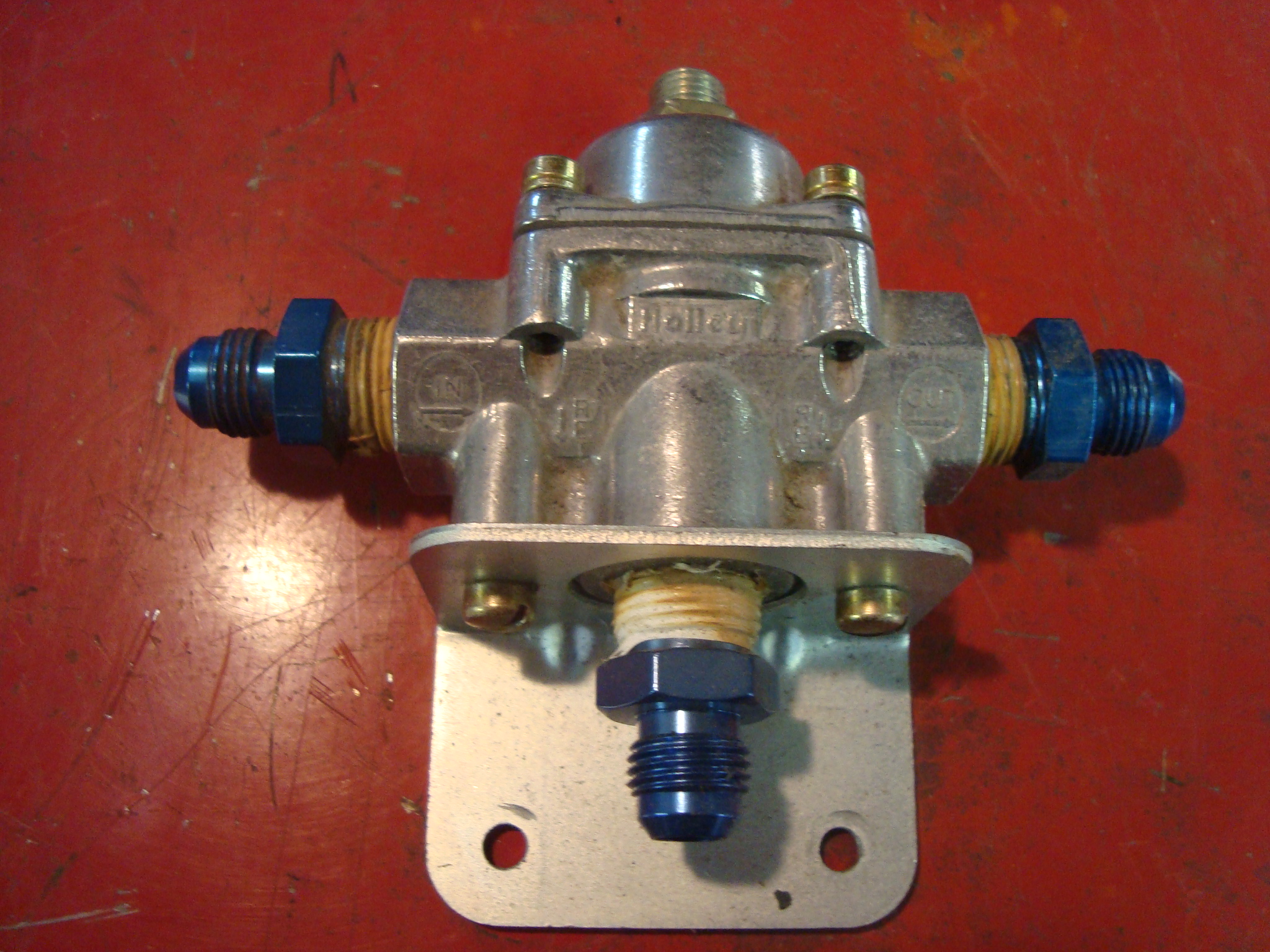 Holley three port fuel regulator. In, Out, Bypass. Danny L Sharer