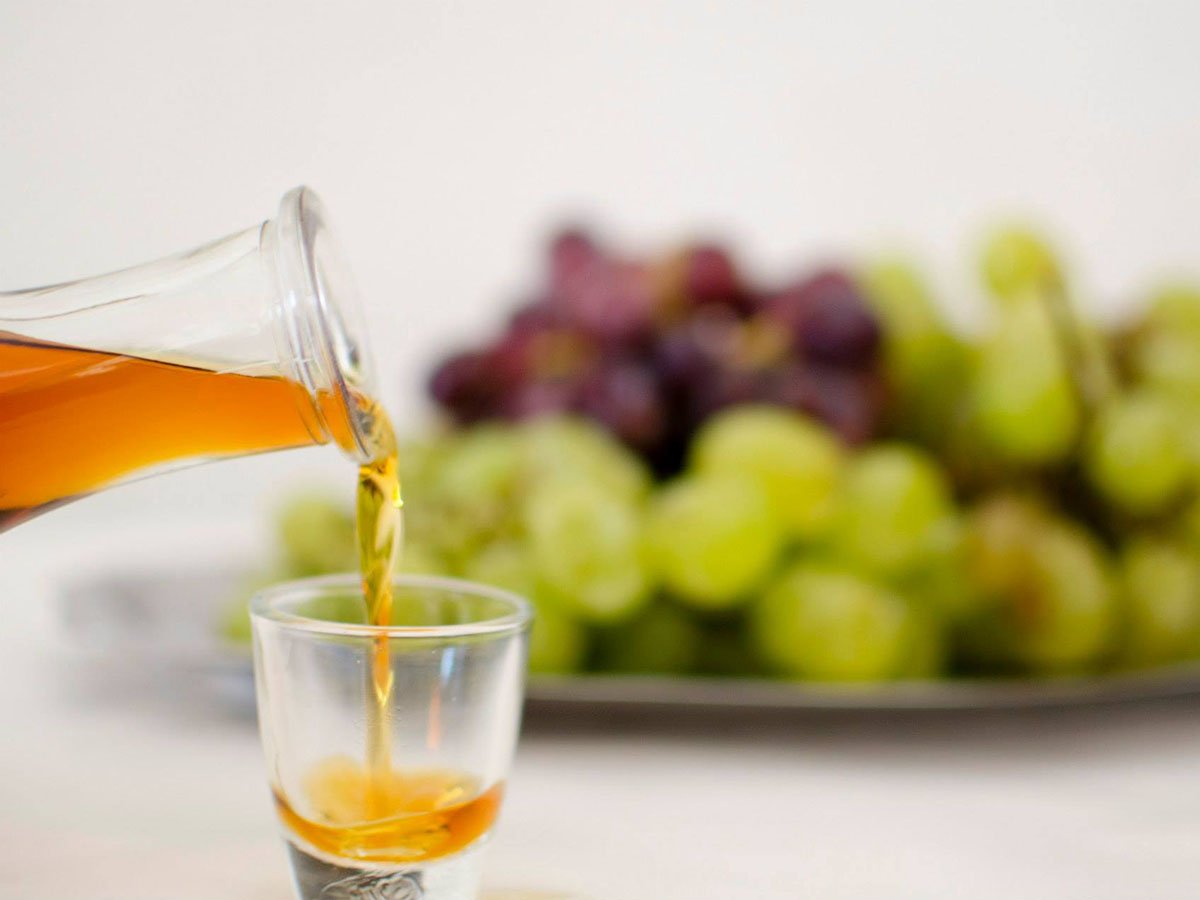 Psimeni raki homemade liquor with flavor of honey and clove Festival 26/7