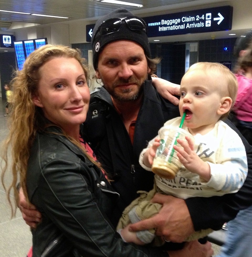 Amy with husband Aaron and son Eli upon Aaron’s return from one of his