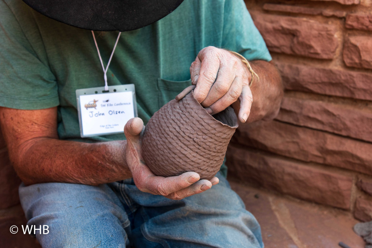 John Olsen forms a corrugated pot. 