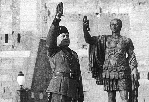 ITALY - SEPTEMBER 18:  Rome Italy 18 september 1965. Premier Benito MUSSOLINI, dictator of Italy, salutes the statue of that former Roman conqueror, Julius CAESAR. The Duce seems to be swearing a silent oath to follow in the heavy footsteps of CAESAR as he prepares his invasion of Ethiopia.  (Photo by Keystone-France/Gamma-Keystone via Getty Images)